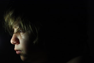 a close up of a person in the dark