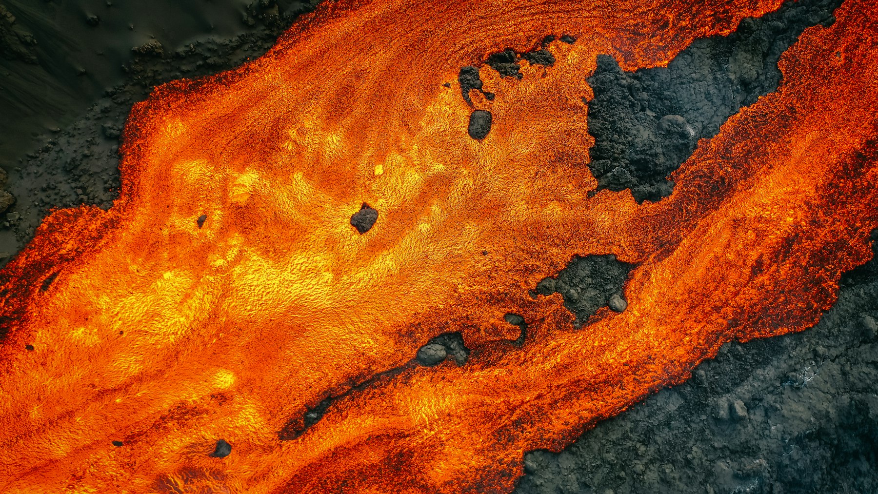 Close-up of glowing orange and black molten rock