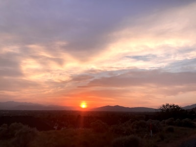 A scenic sunset over rolling hills recently added to our portfolio.