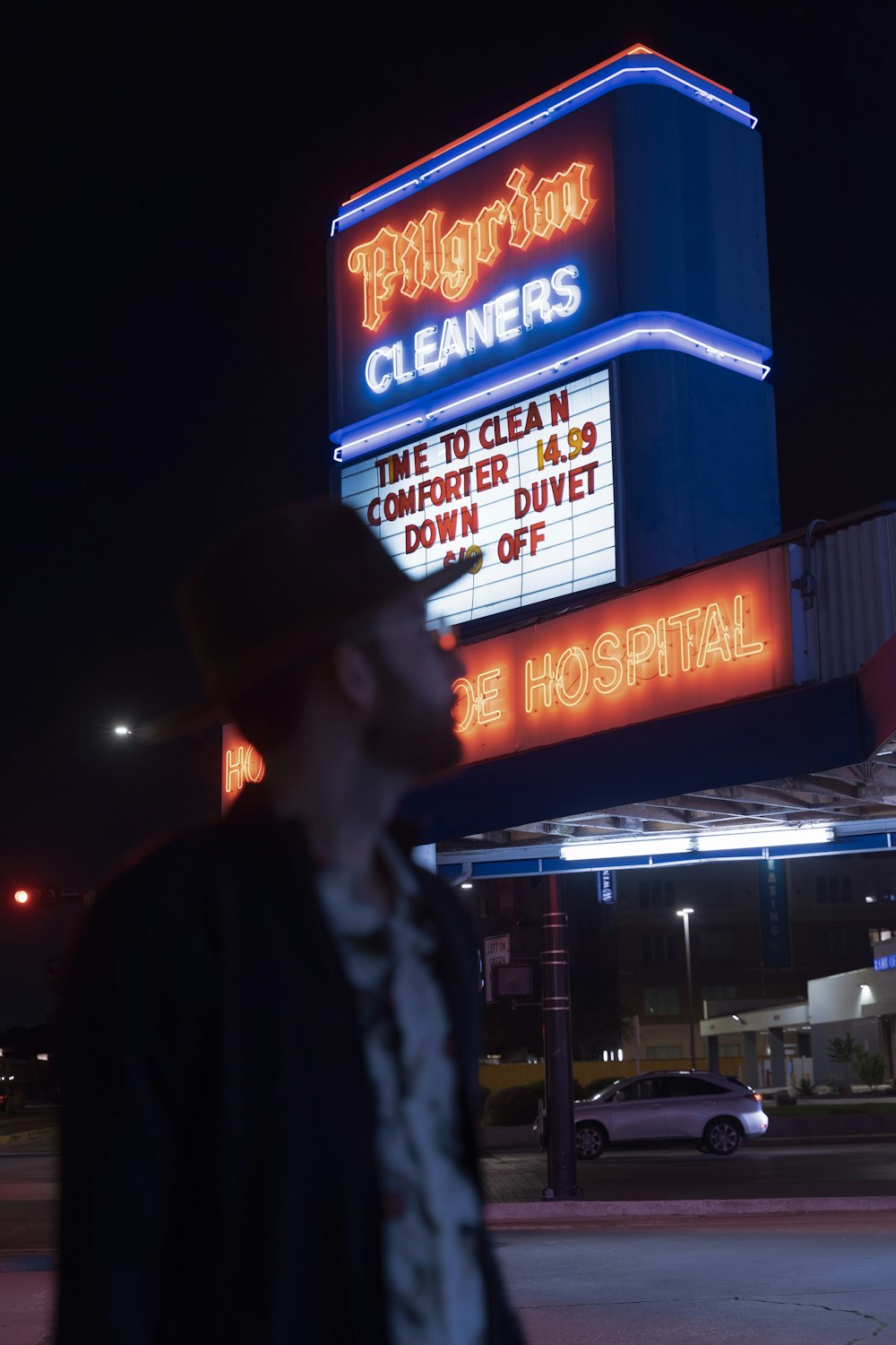 a man standing in front of a theater