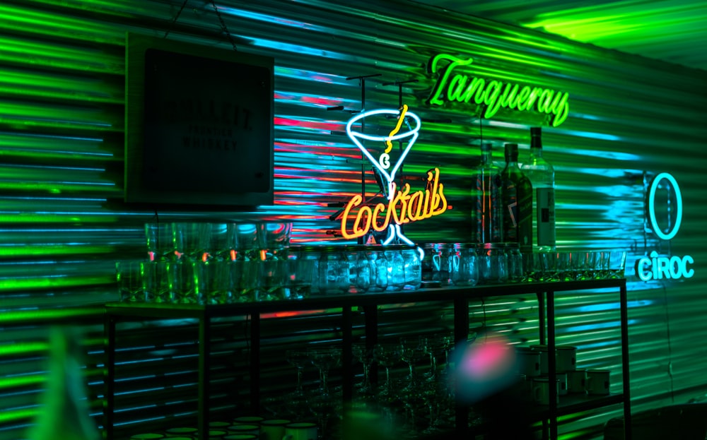 a bar with neon lights and a neon sign
