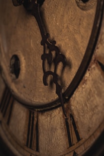 a close up of a clock with roman numerals