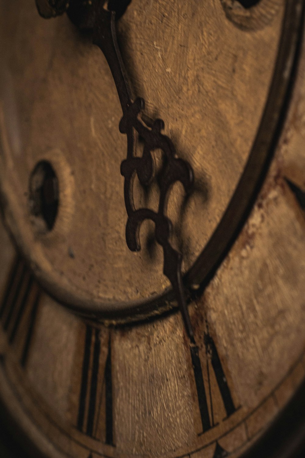 a close up of a clock with roman numerals