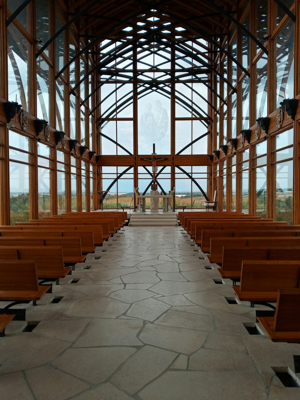 a church with a large amount of wooden pews