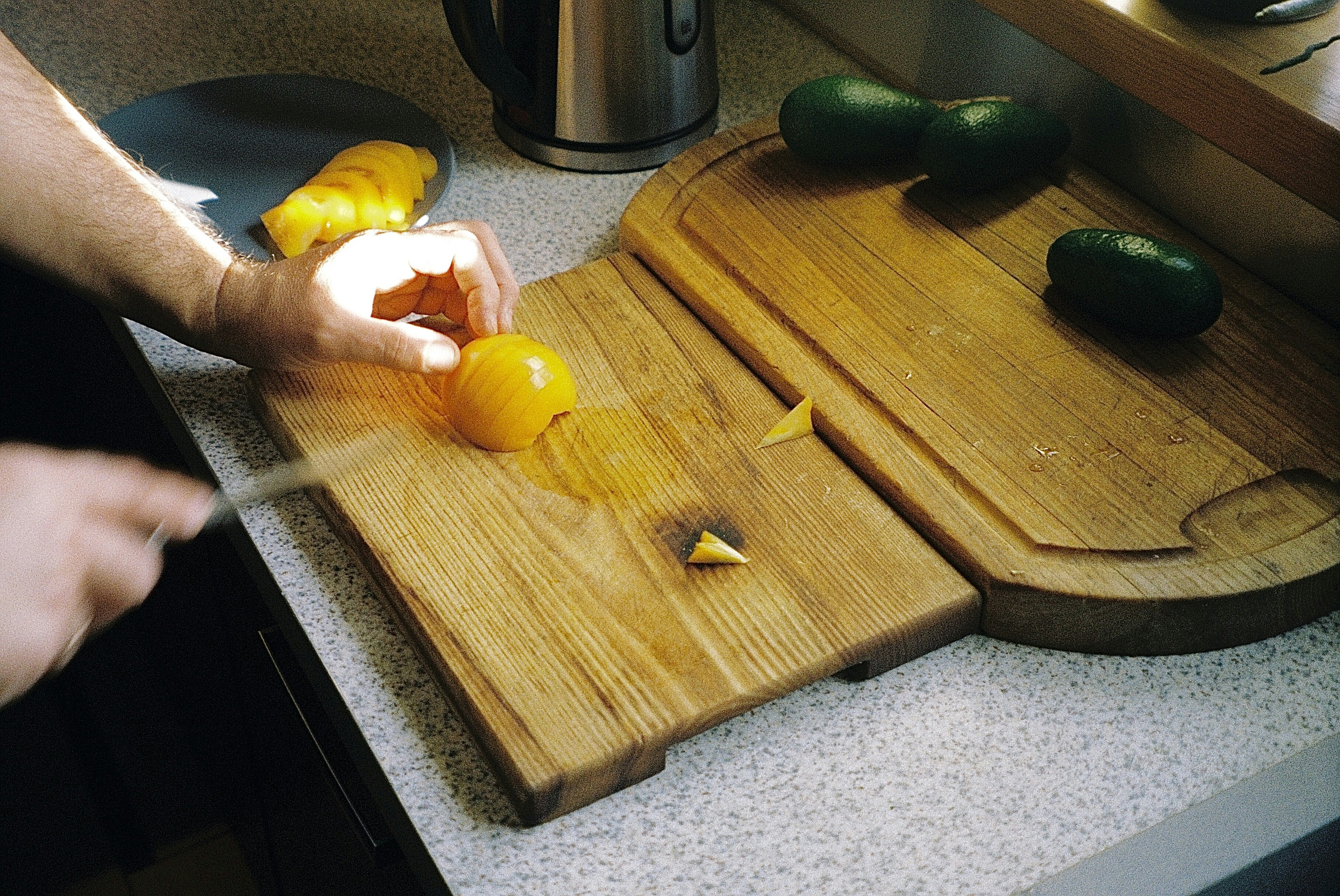 Paring Knife On A Wooden Cutting Board With Fruits And Vegetables Being Prepared
