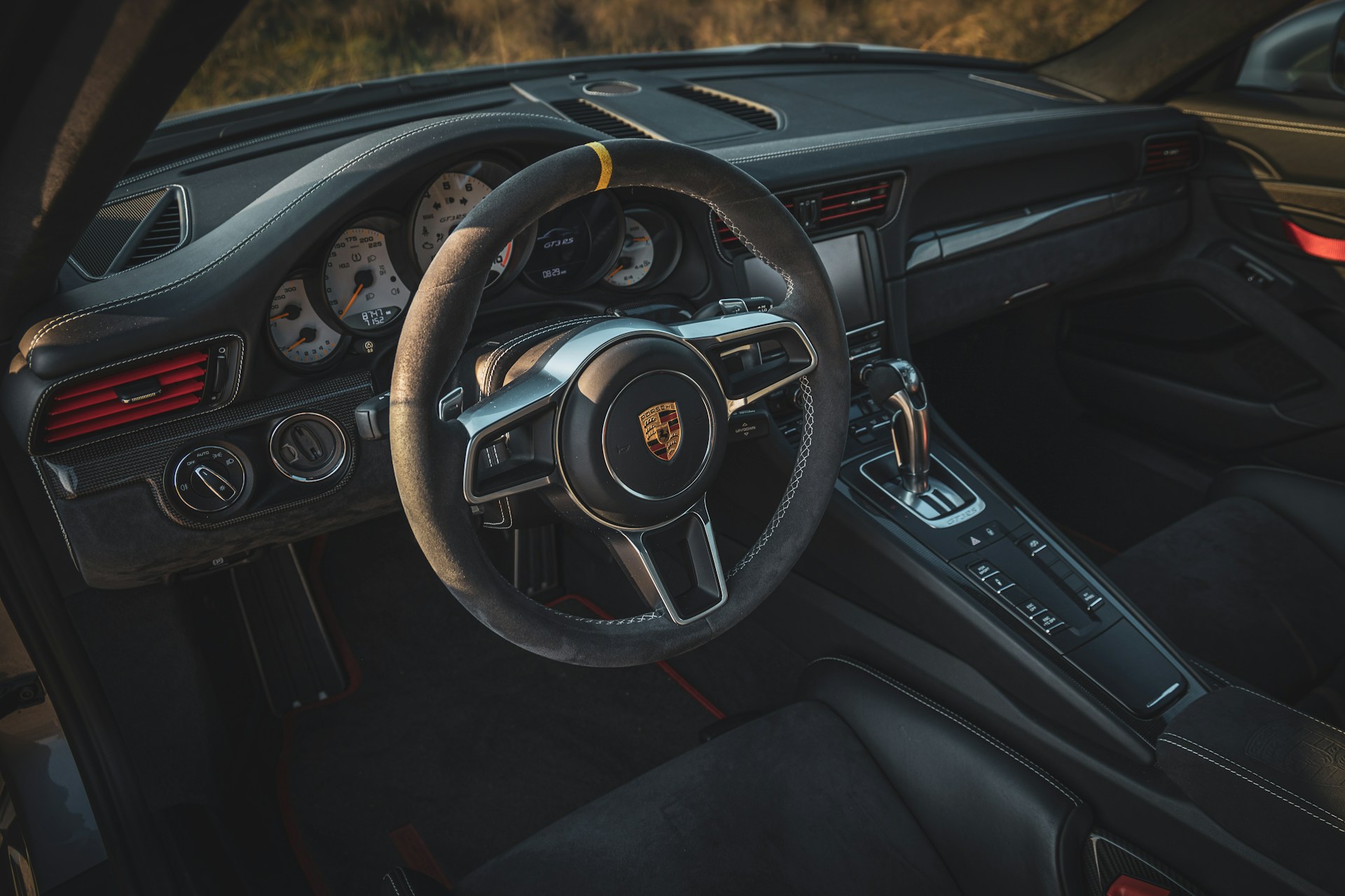 the interior of a car with a steering wheel and dashboard