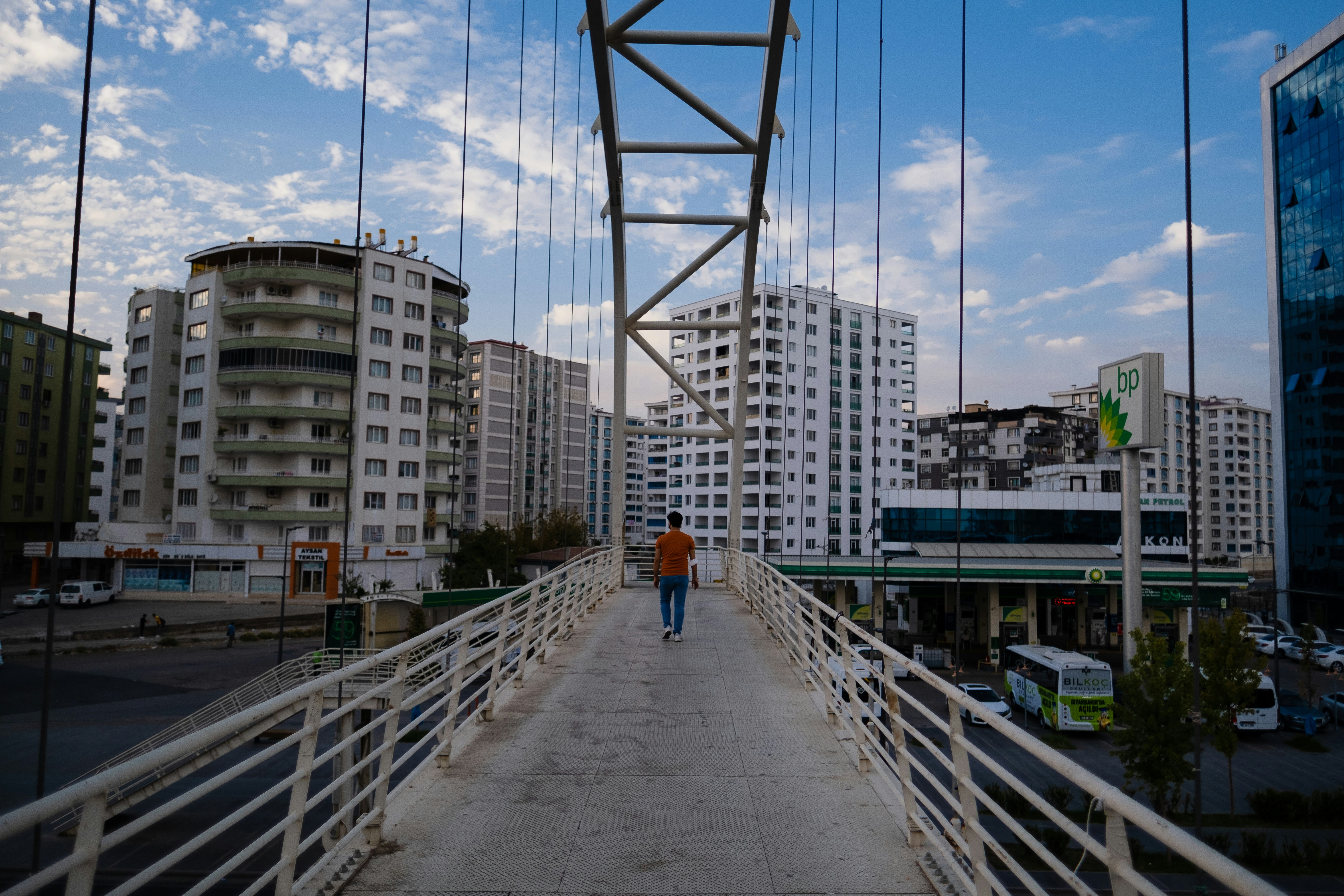 a group of people walking on a bridge