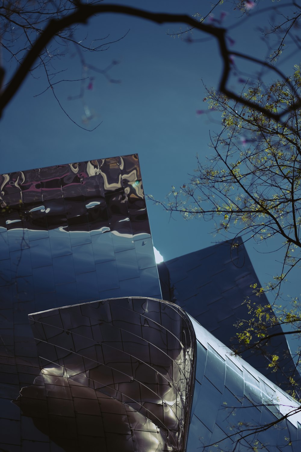 a reflection of a building in a mirror