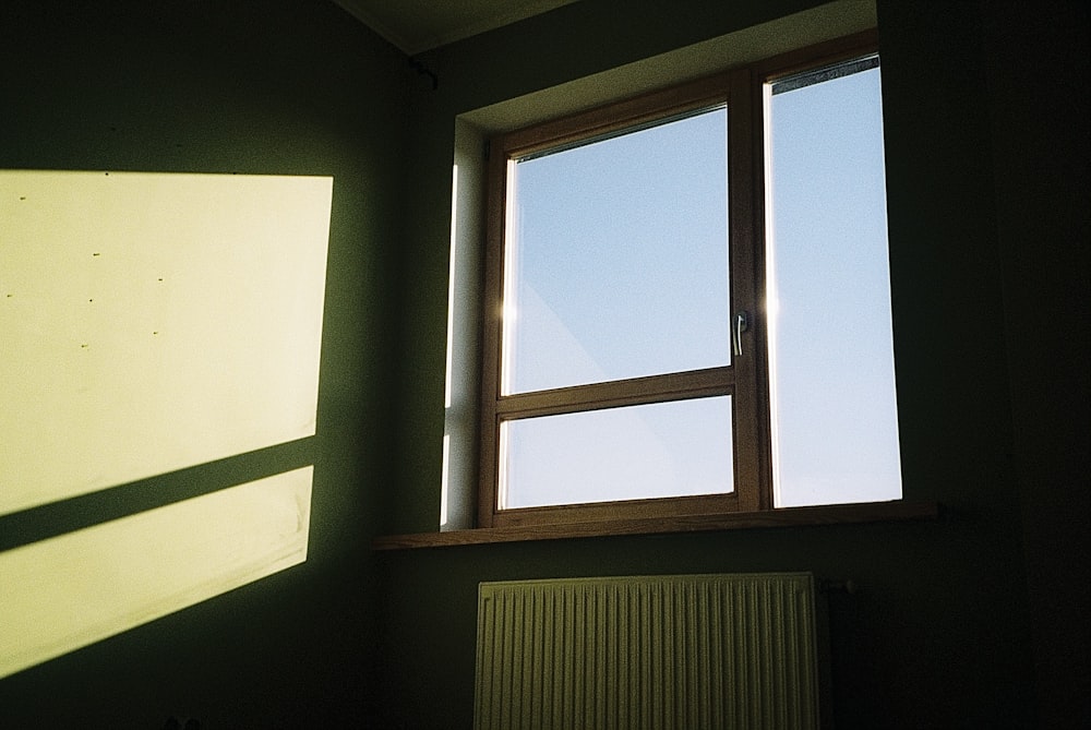 a room with a window and a radiator