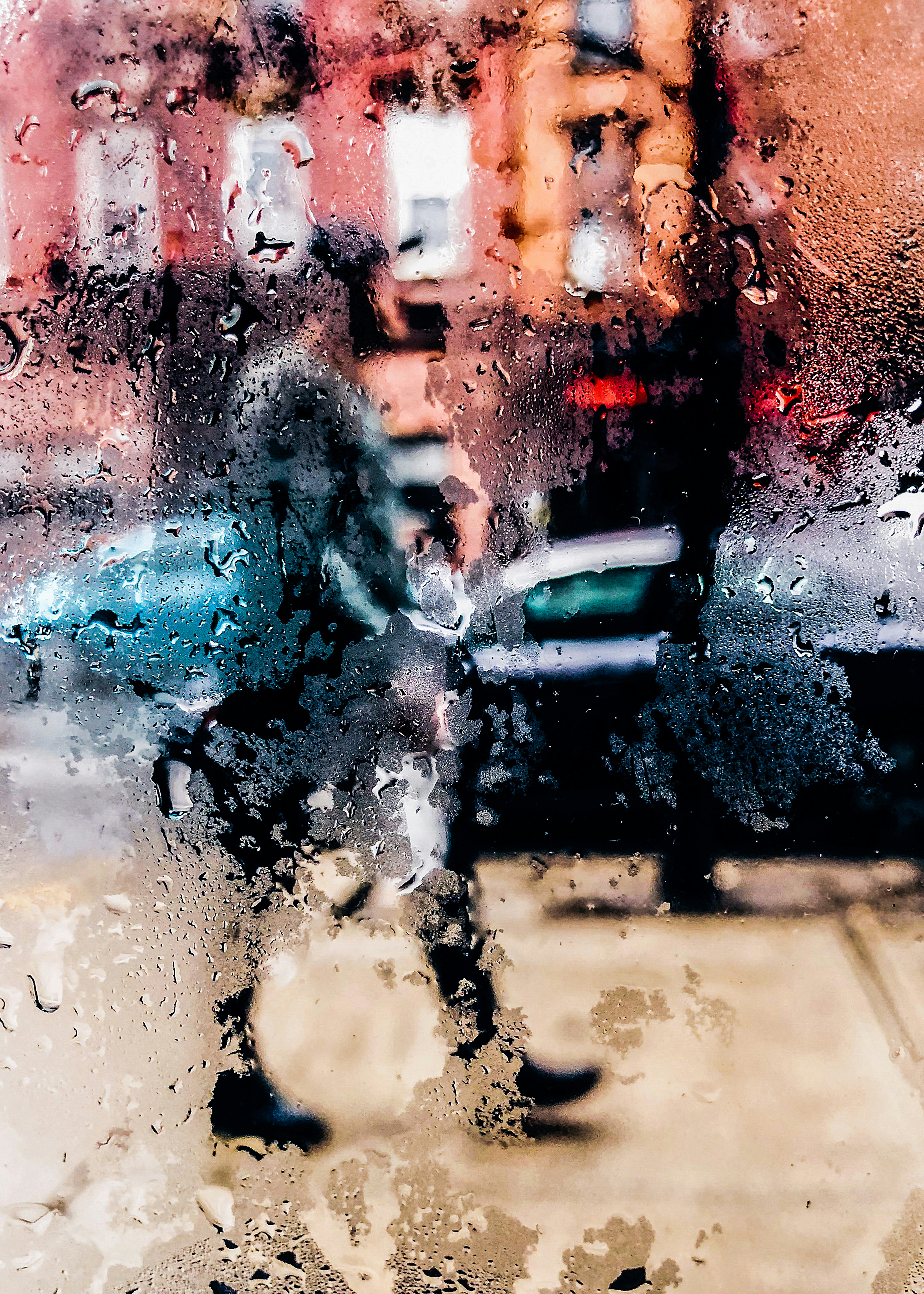 a person walking down a street holding an umbrella