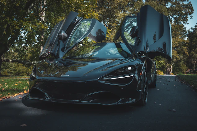a black sports car with its doors open