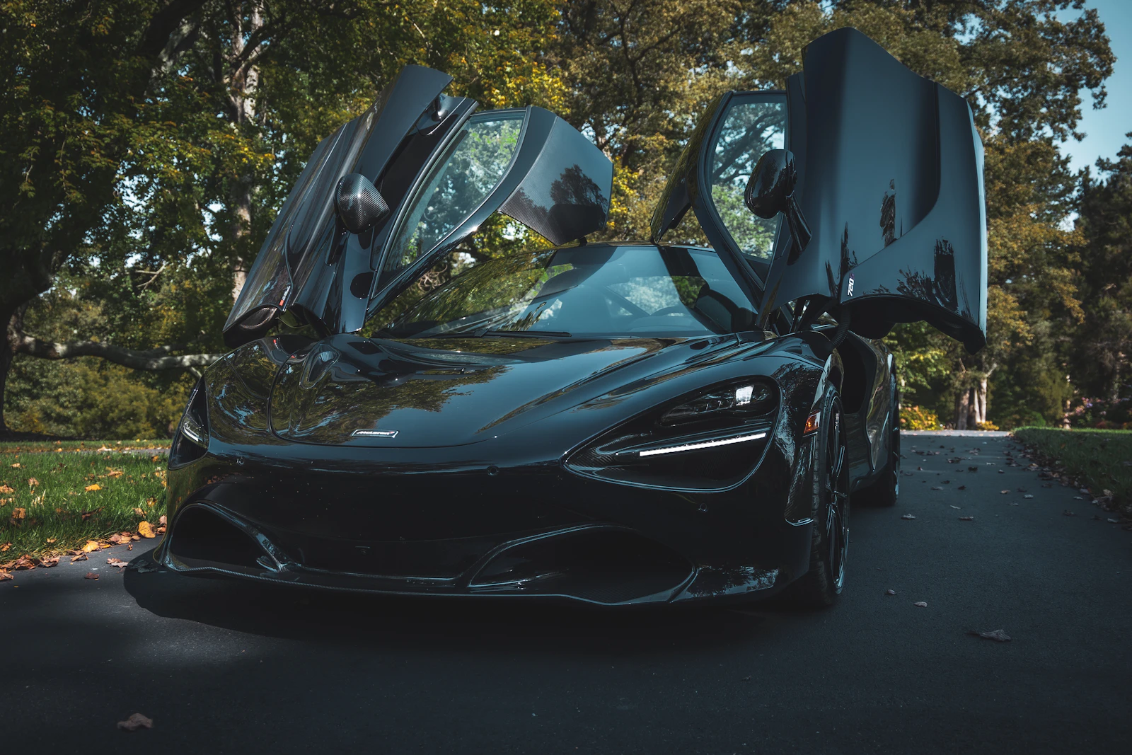 Black McLaren 720S with its doors open