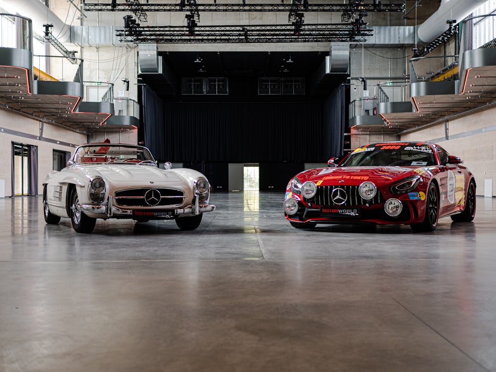 two mercedes benz sports cars parked in a garage
