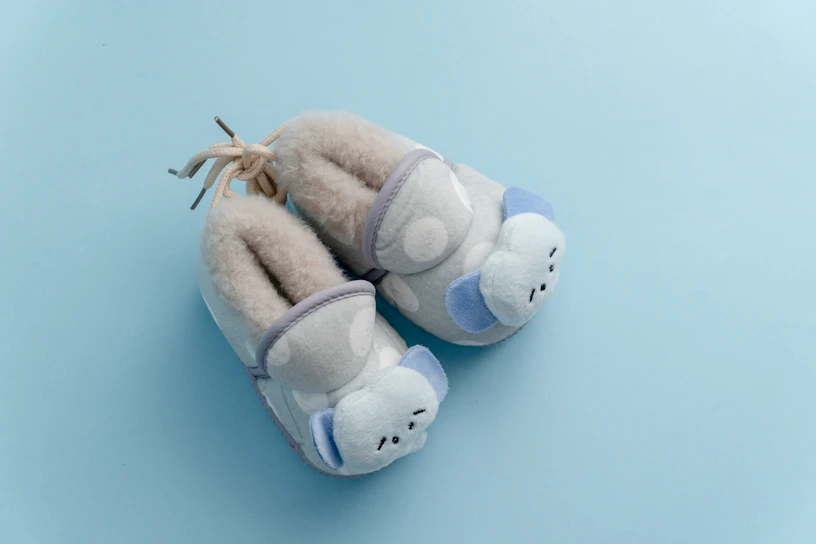 A cozy display of children's pajamas in soft pastel colors with gentle animal prints.