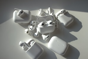 a group of apple airpods sitting on top of a table