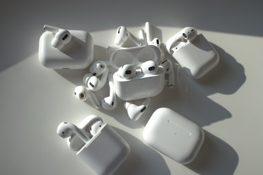 a group of apple airpods sitting on top of a table