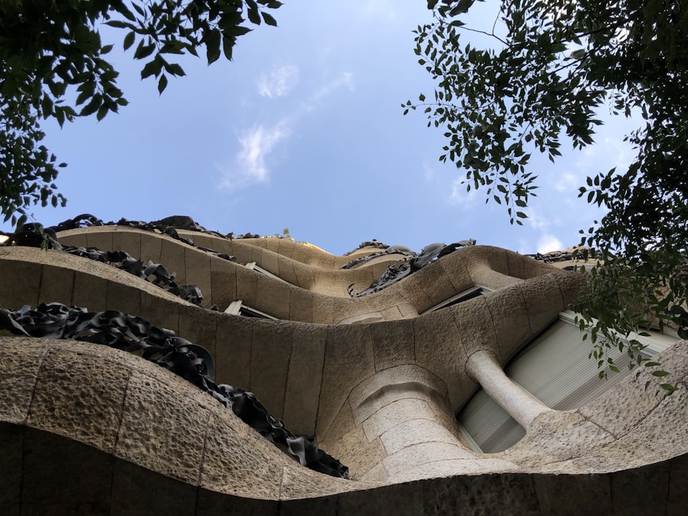 a view of a building from below looking up at the roof