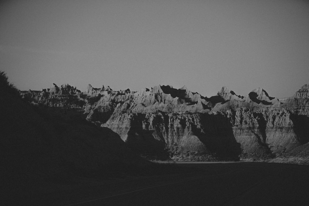 a black and white photo of a mountain range