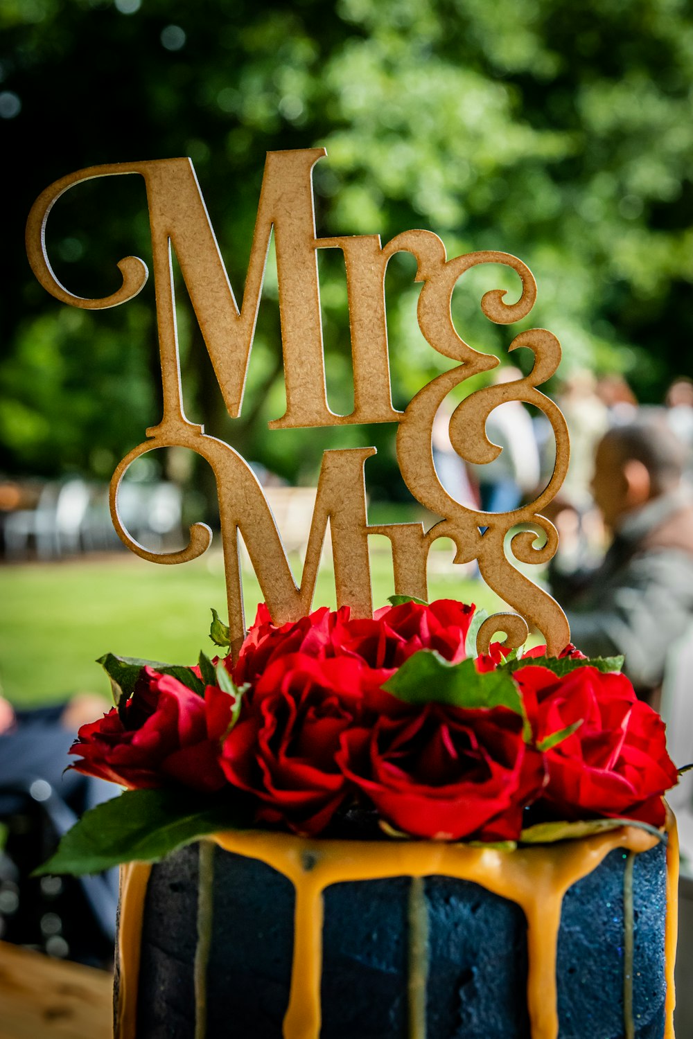 a cake with a cake topper that says mr and mrs on it