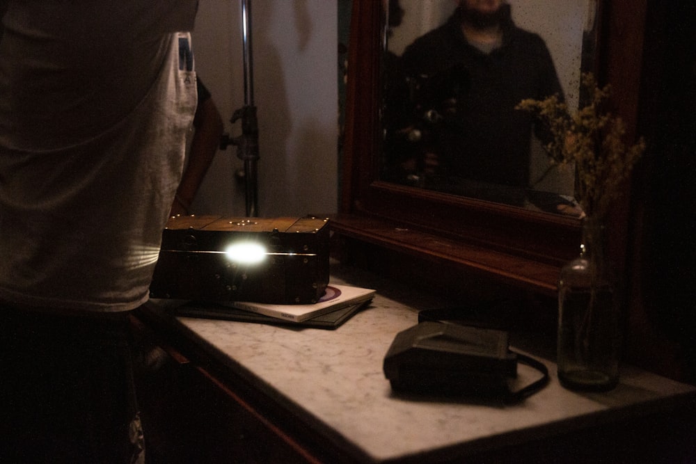 a man taking a picture of himself in a mirror