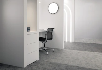 Minimalist white desk with metal legs in a bright modern room