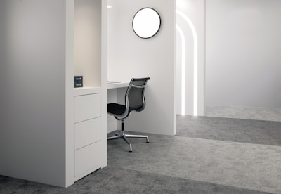 A sleek, minimalist office space with black, graphite, and gold accents reflecting luxury and focus.