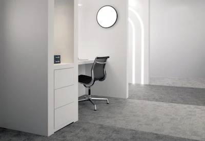 Minimalist white desk with metal legs in a bright modern room