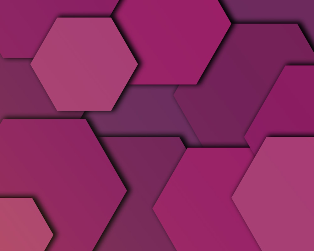 a purple and red background with hexagonal shapes