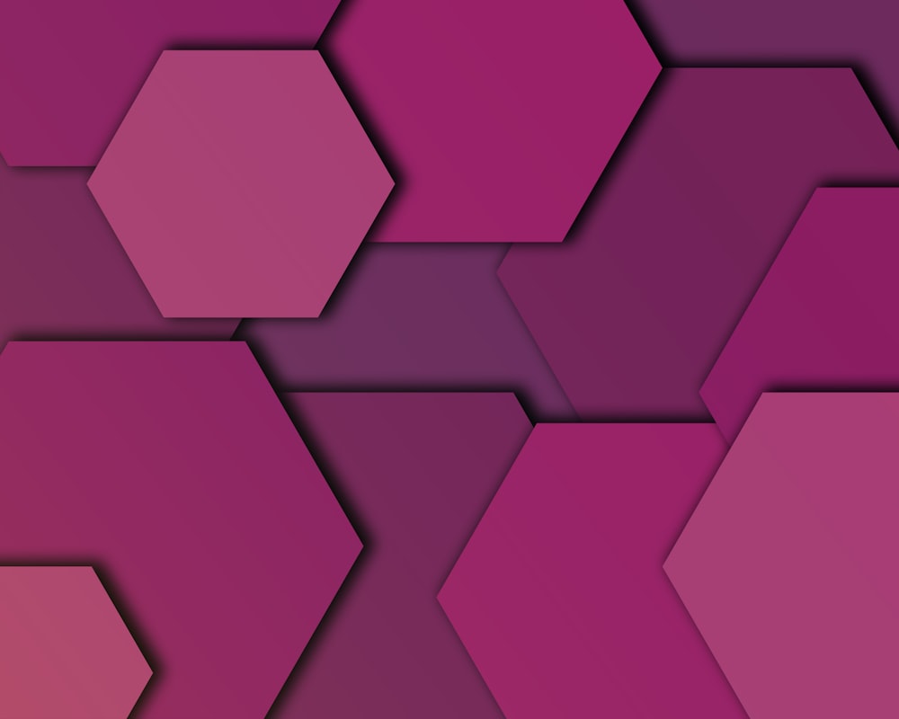 um fundo roxo e vermelho com formas hexagonais