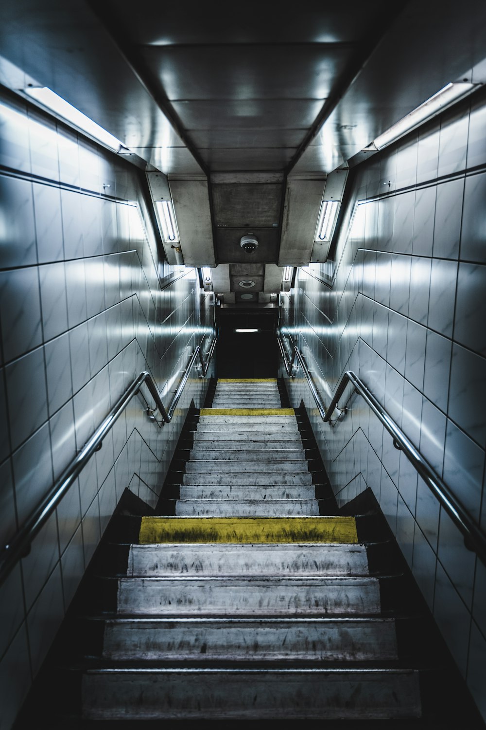 a set of stairs leading up to the top of a flight of stairs