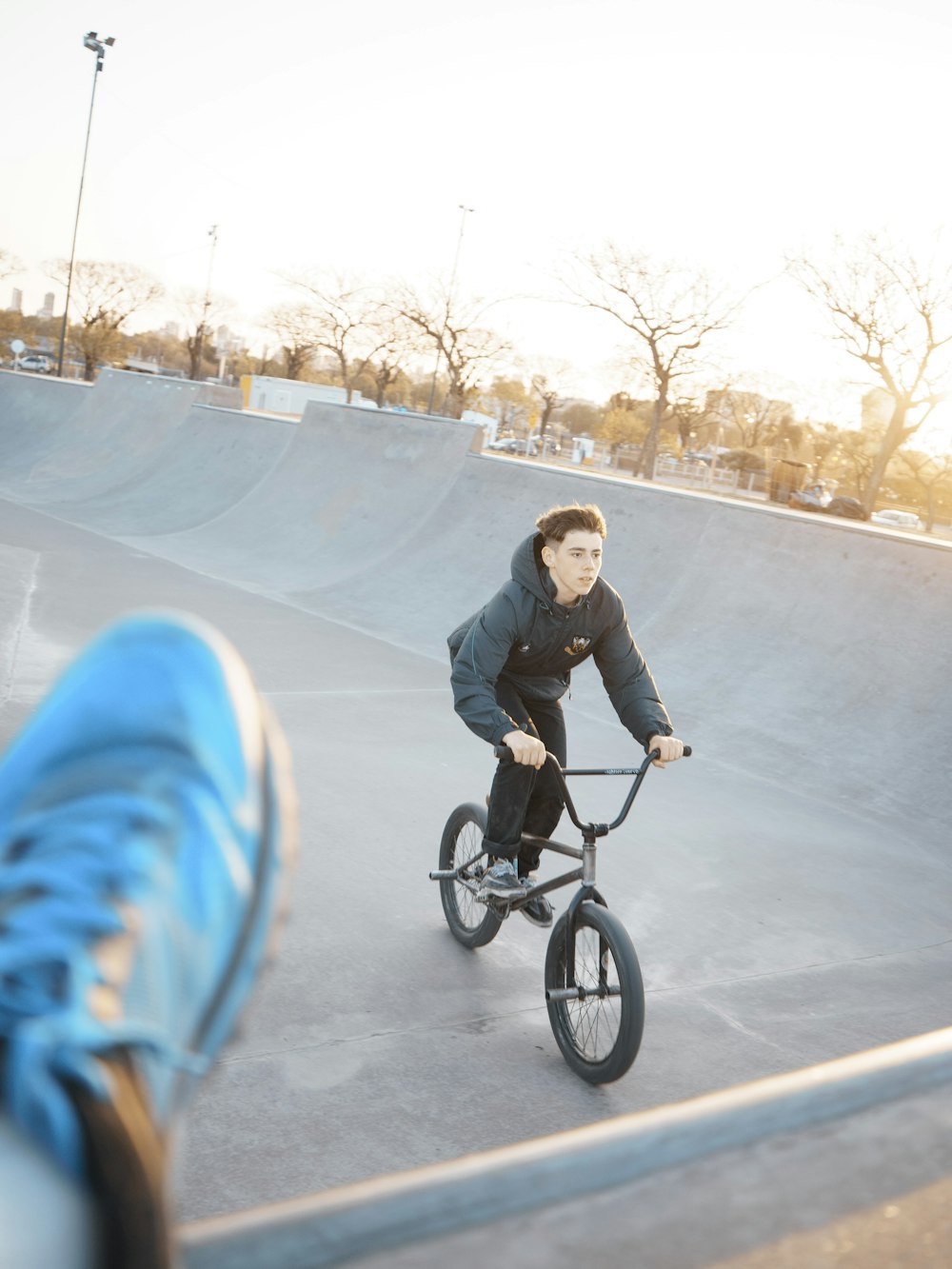 a person riding a bike in a skate park