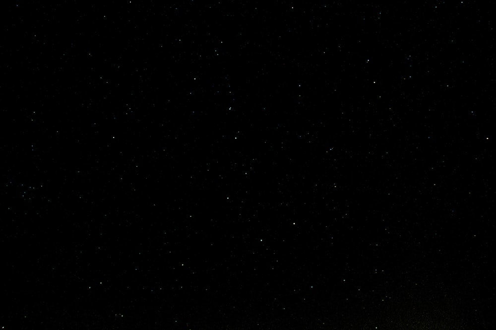 a dark night sky with a few stars