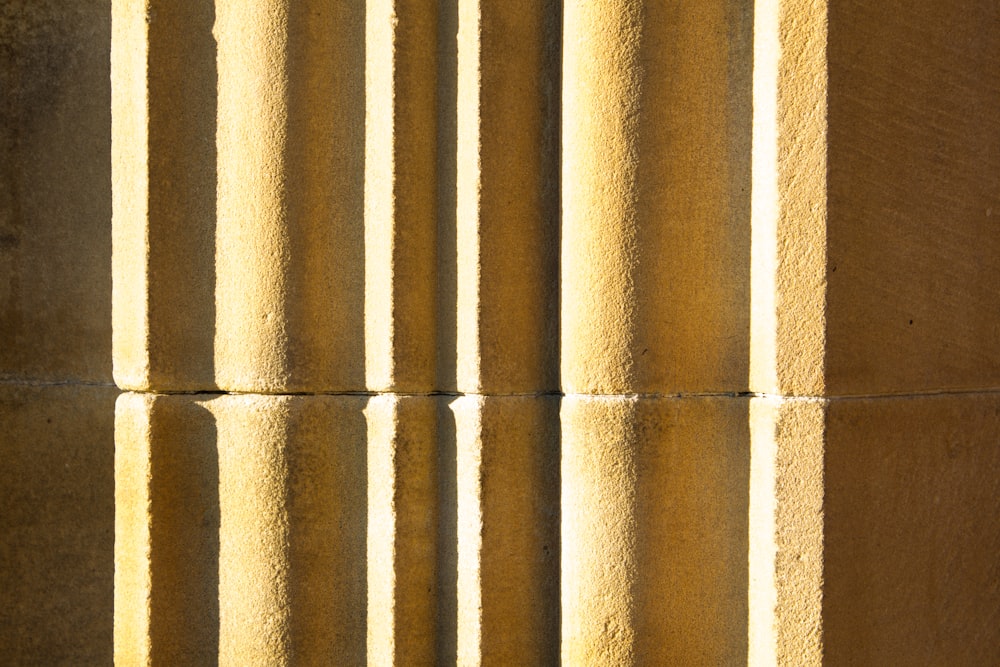 a close up of a wall with columns