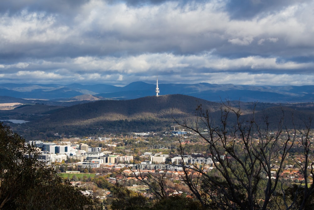 a view of a city with mountains in the background