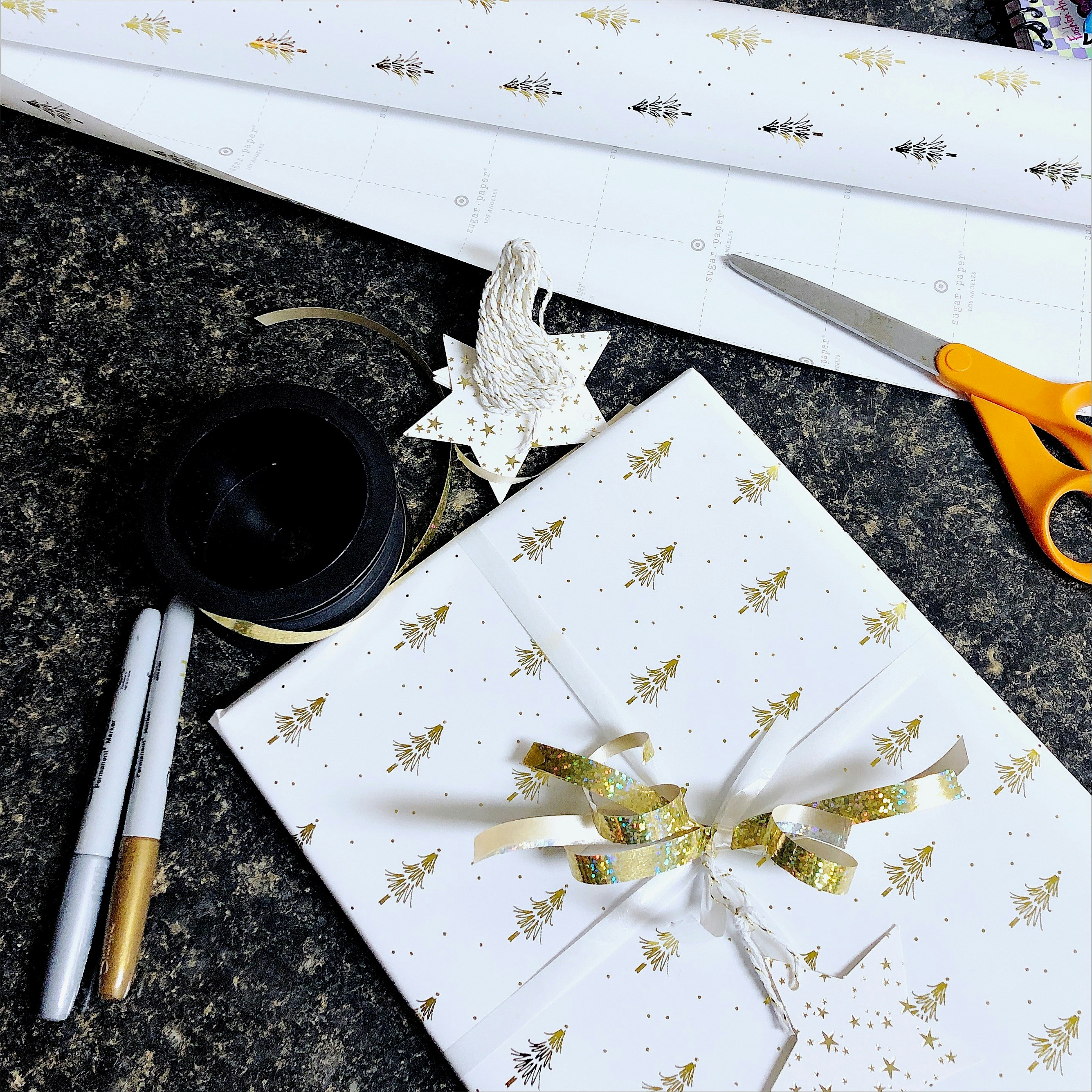 a pair of scissors and some wrapping paper