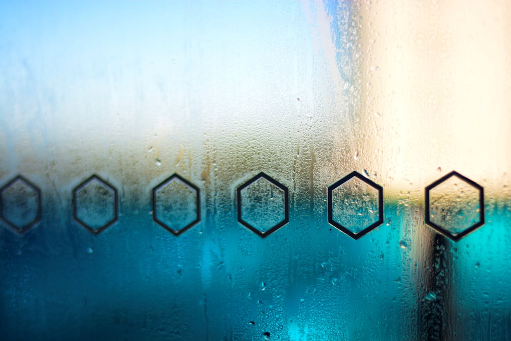 a close up of a window with rain drops