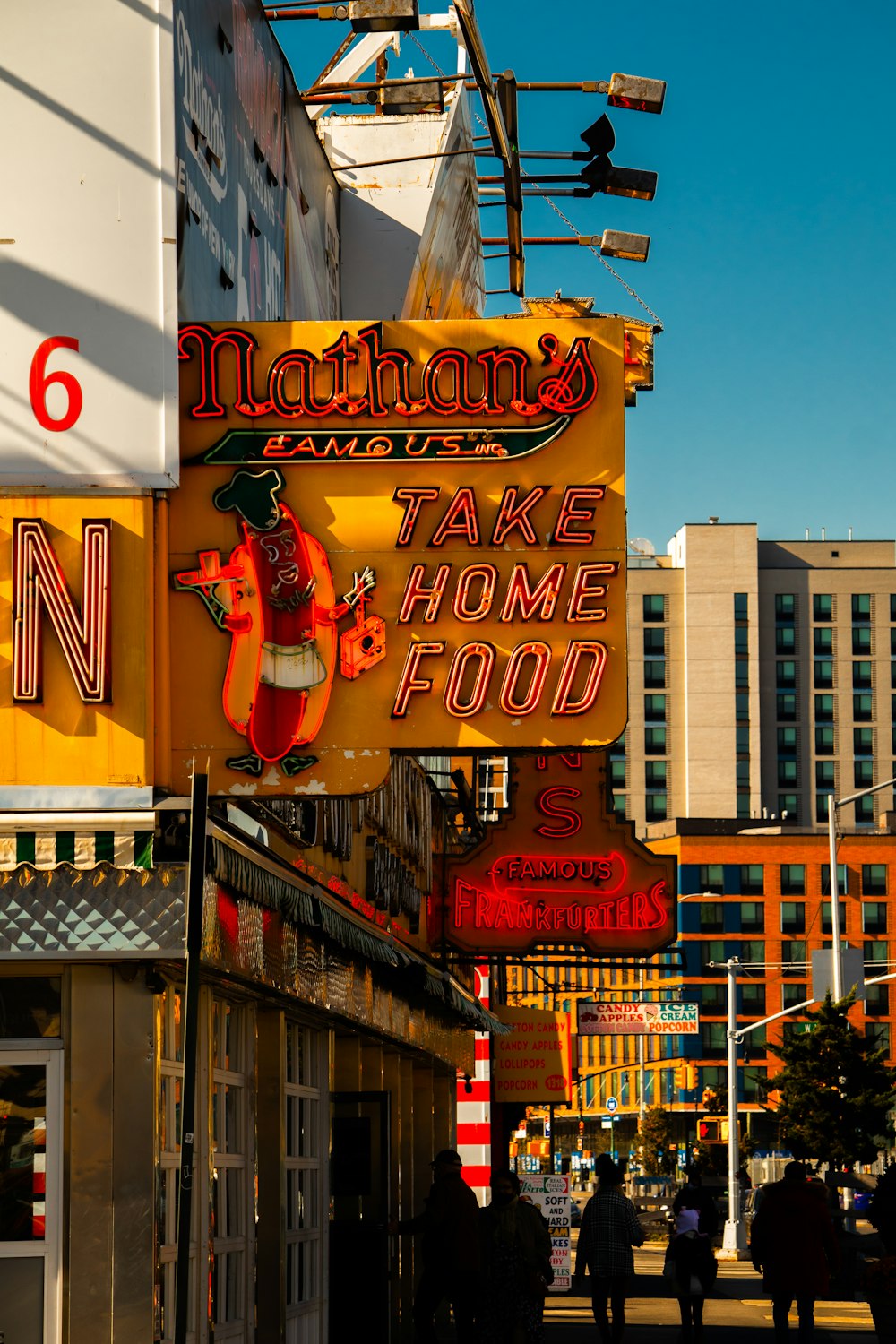 a neon sign for nathan's take home food