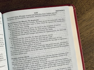 a book opened to a page of text on a table