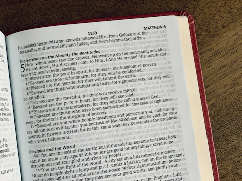 a book opened to a page of text on a table