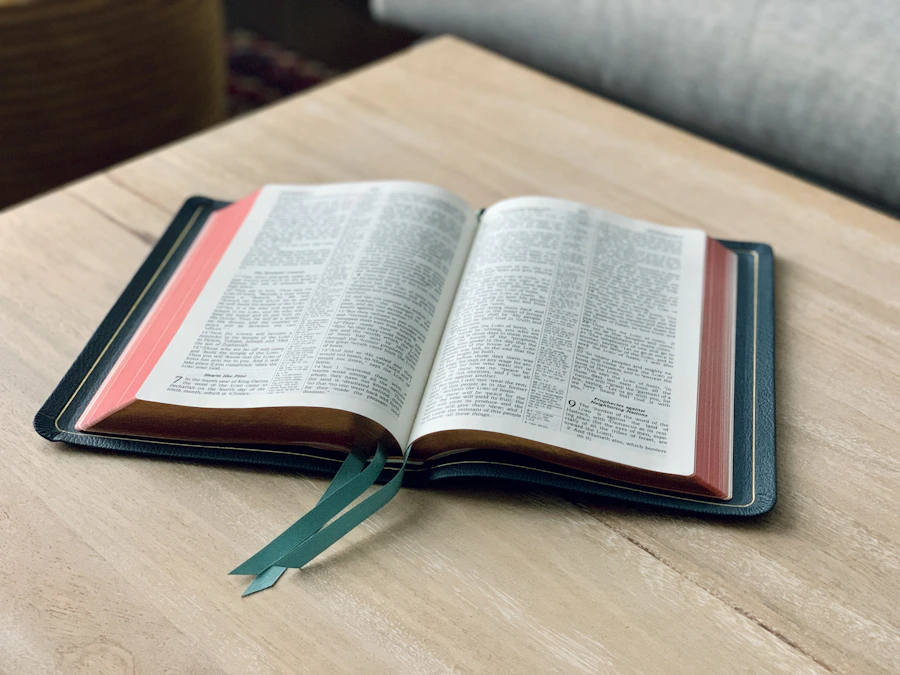 An open Bible on a wooden table