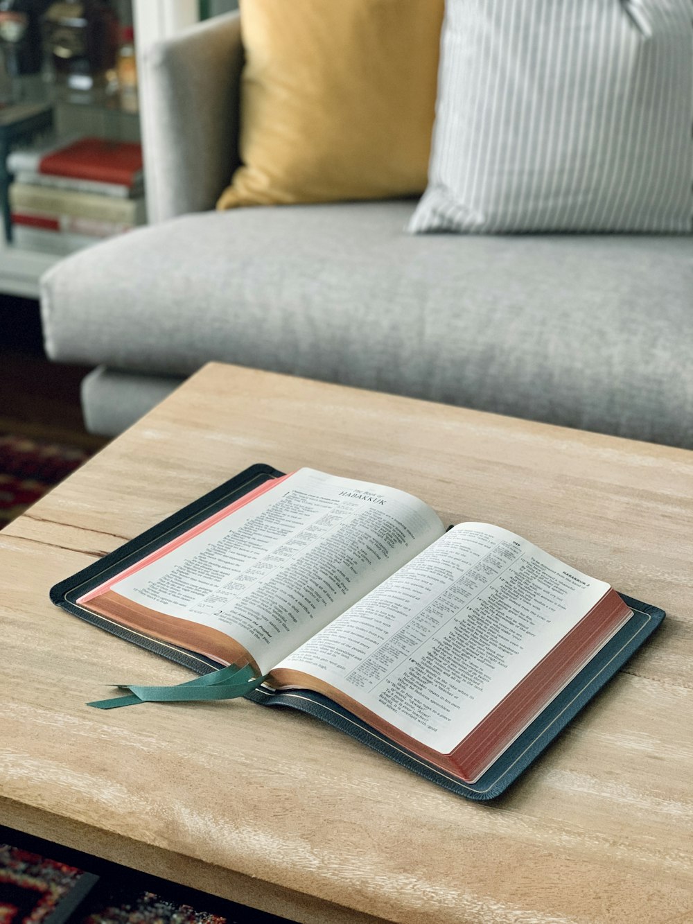 an open book sitting on top of a wooden table