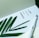 A page with a motivational quote is paired with a green plant leaf and a white fountain pen. The quote reads 'The joy of the Lord is your strength.' The setting conveys a serene and inspirational atmosphere.