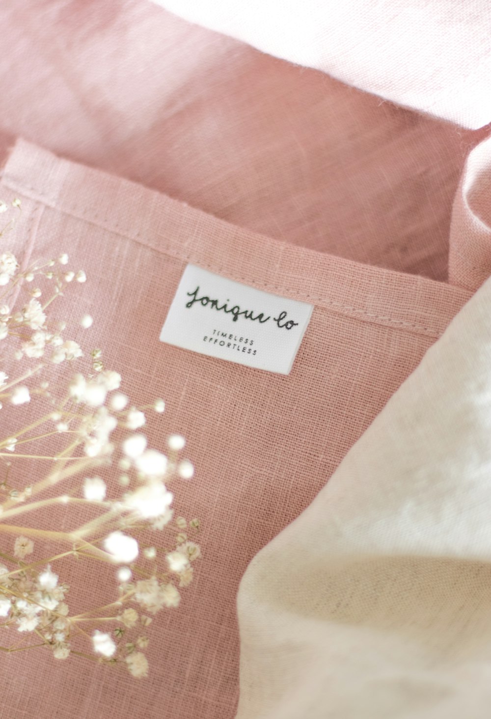 a close up of a pillow with a label on it