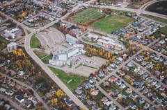 an aerial view of a large building surrounded by trees