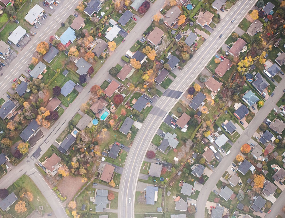 an aerial view of a neighborhood in the fall