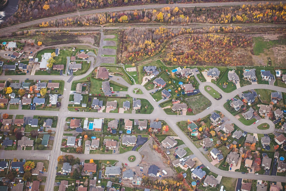 an aerial view of a neighborhood in the fall