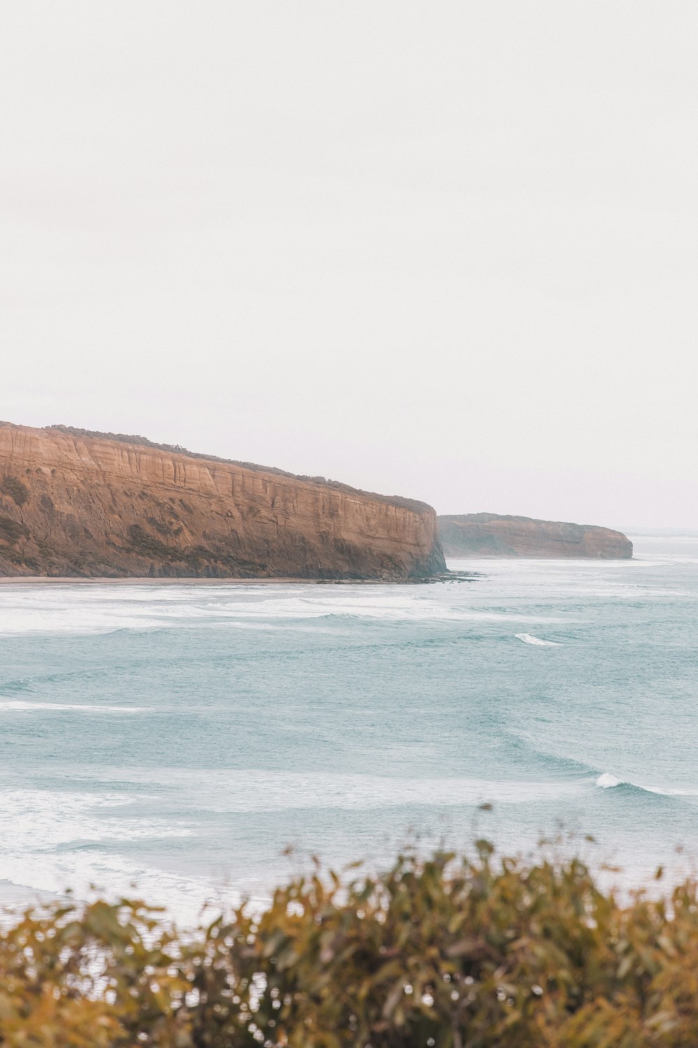 a man riding a surfboard on top of a wave in the ocean