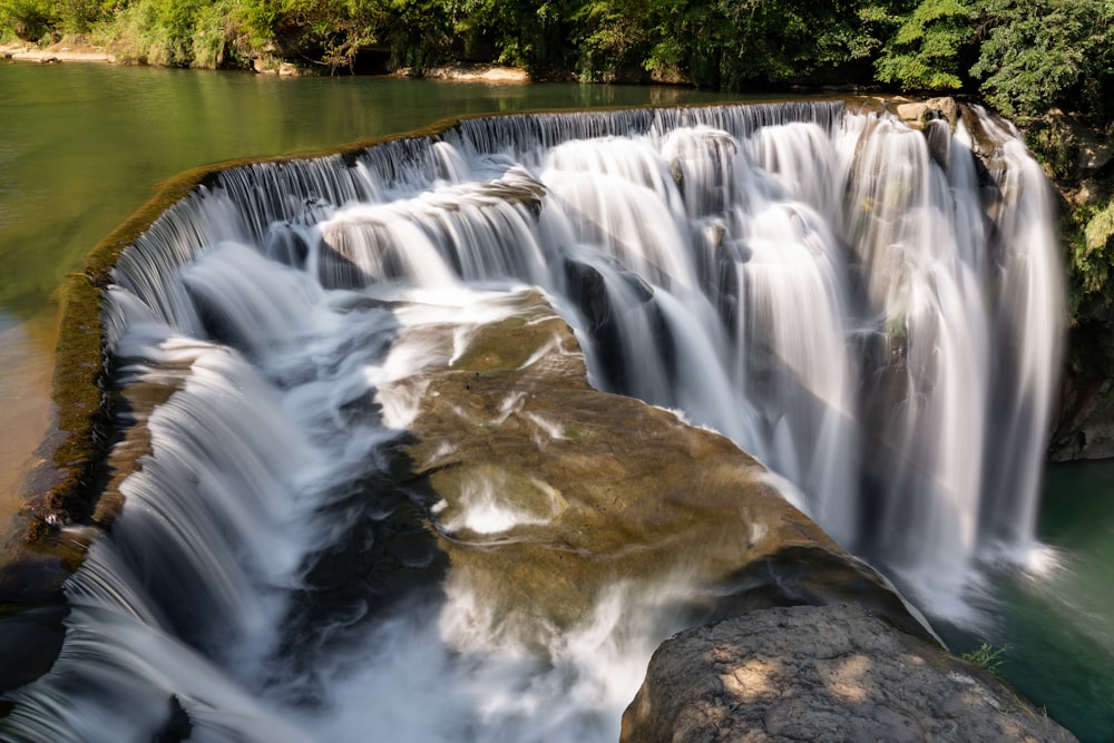 a large waterfall with lots of water coming out of it