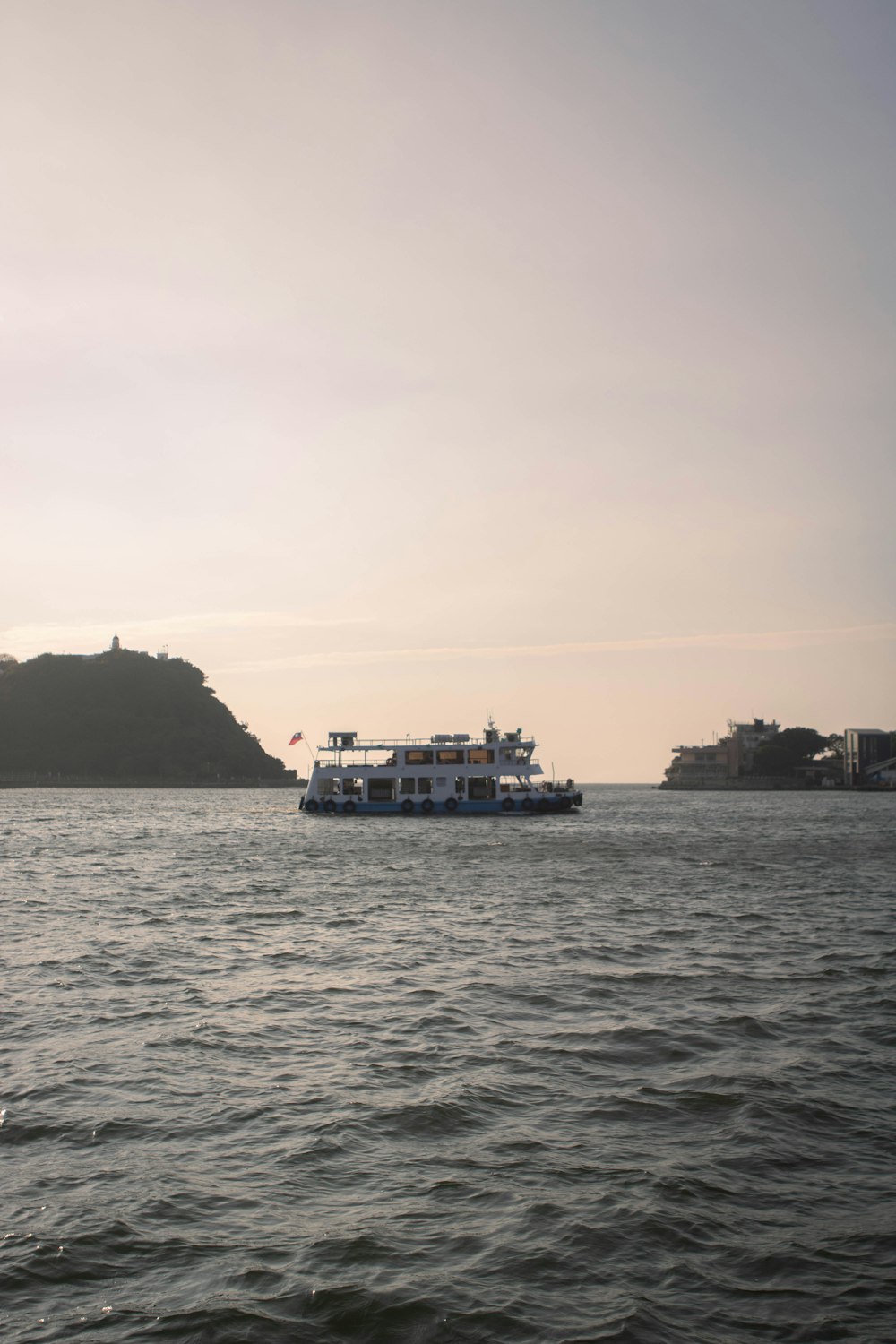 a large boat floating on top of a large body of water