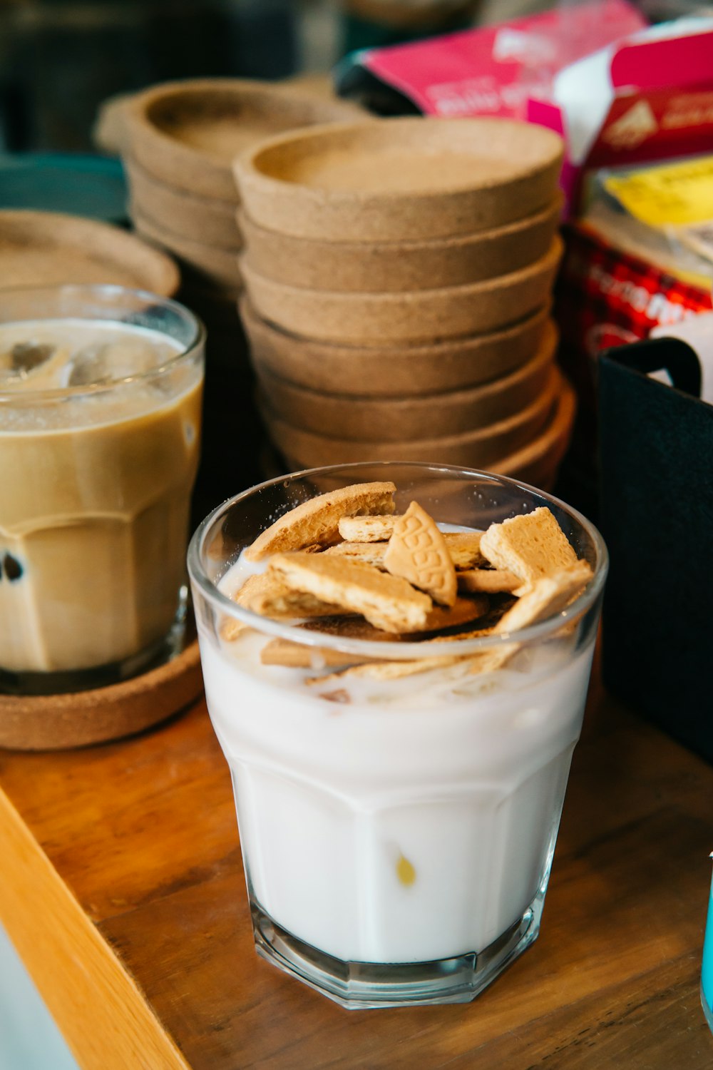 a glass of milk and some food on a table